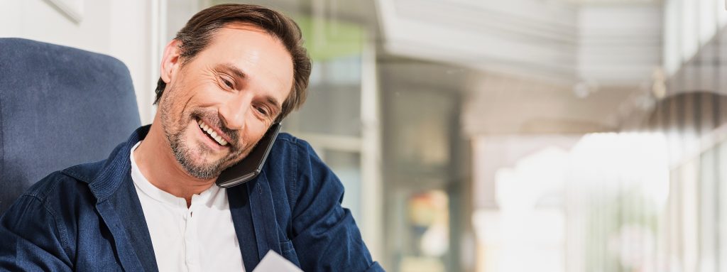 Man speaks on phone regarding technical assistance