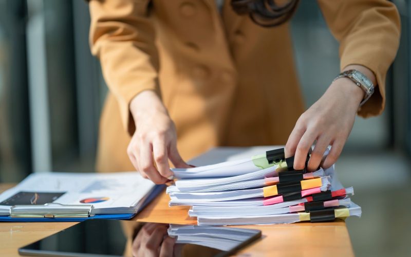 Careers Planner Searching Planning Materials Women reviewing planning documents spread across a table.