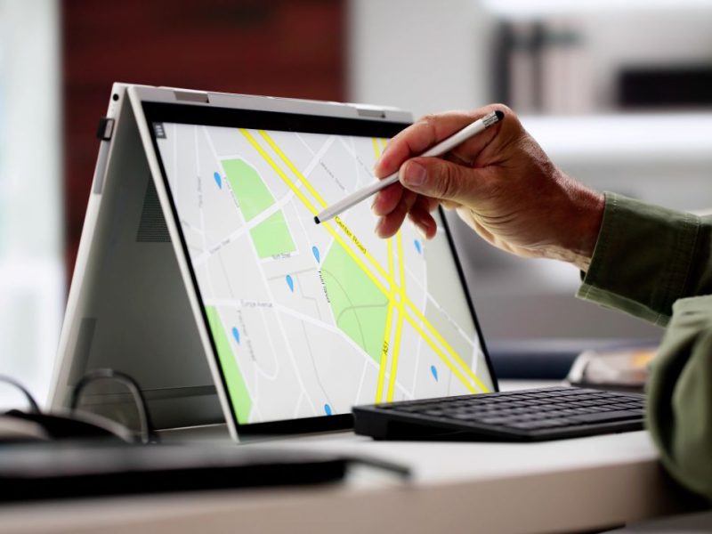 Careers Planner Using Tablet Man using a tablet to review a map points to a location.