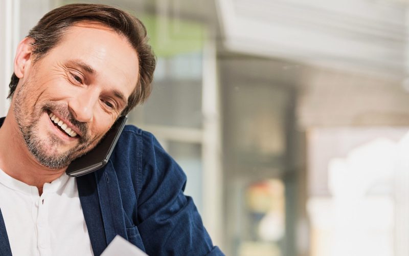 Man speaks on phone regarding technical assistance